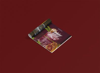 A magazine is sitting on top of a red table.