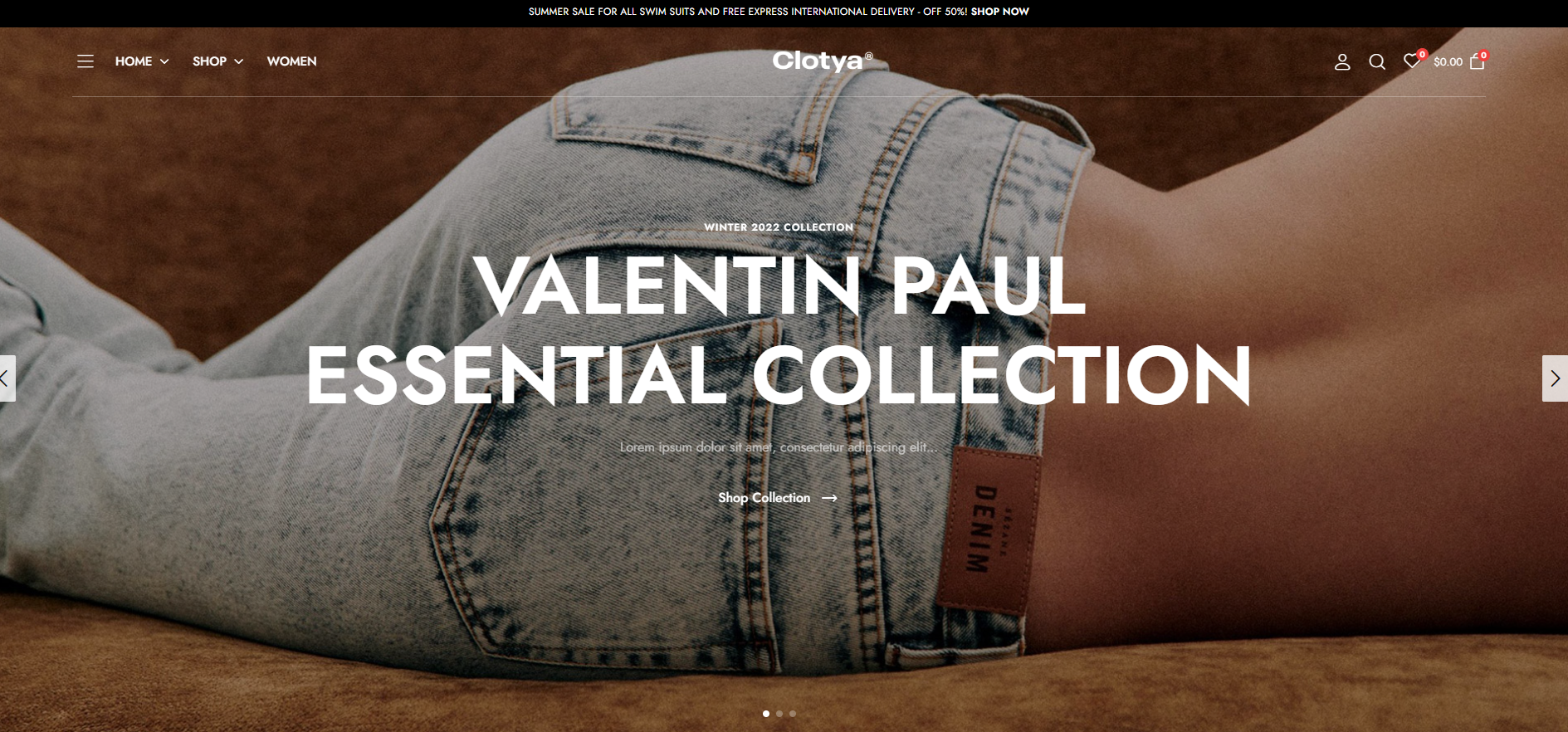 A woman is laying on a bed wearing a pair of jeans.