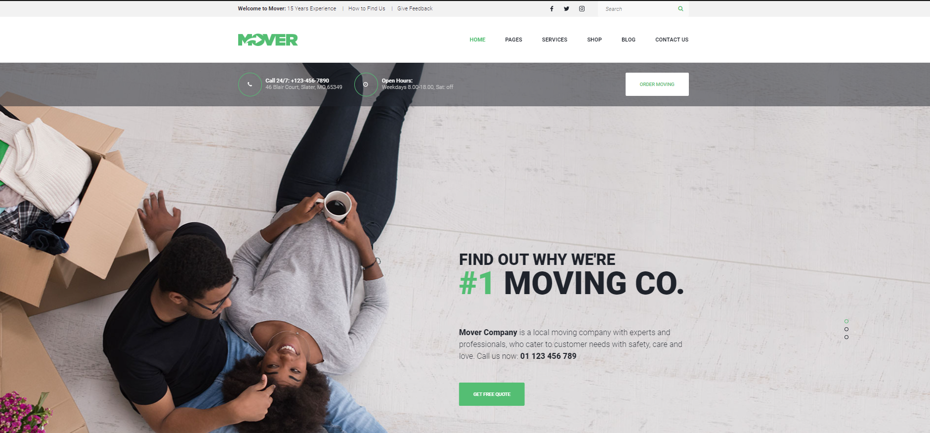 A man and a woman are laying on the floor next to moving boxes.