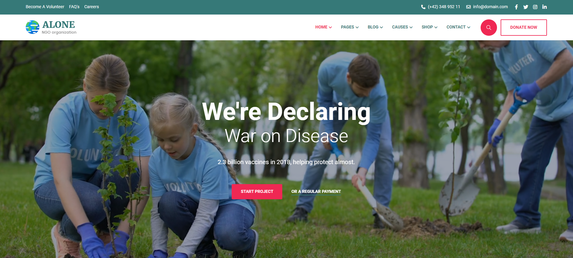 A group of people are kneeling down in the grass planting trees.