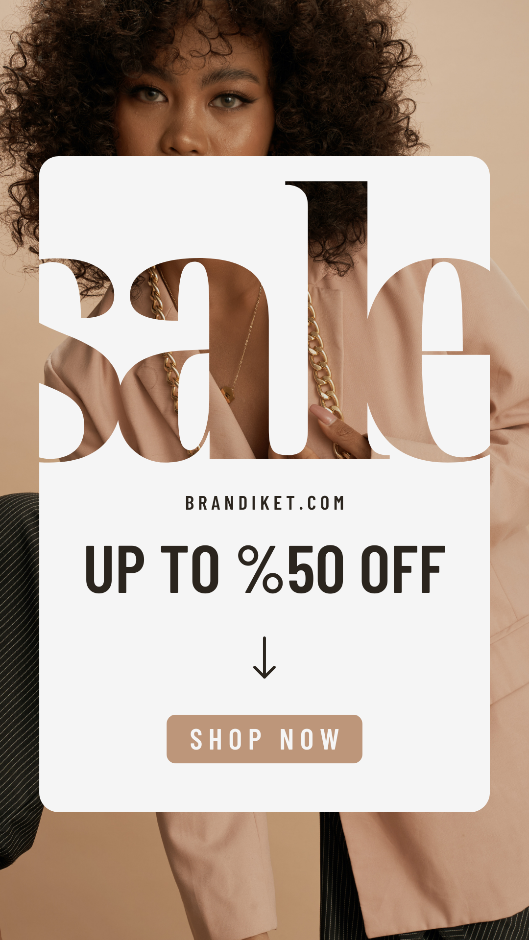 A woman with curly hair is standing in front of a sign that says sale up to 50 off.