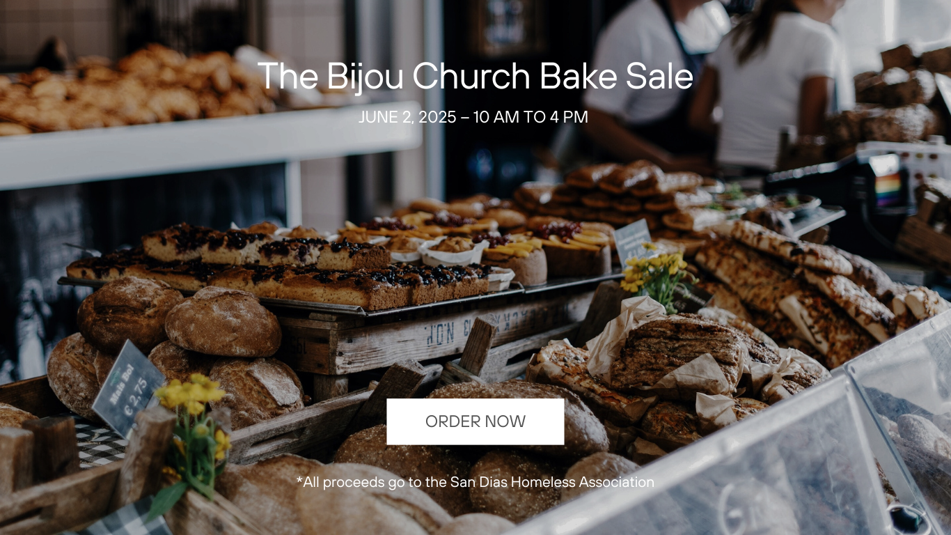 A bakery with lots of bread and pastries on display.