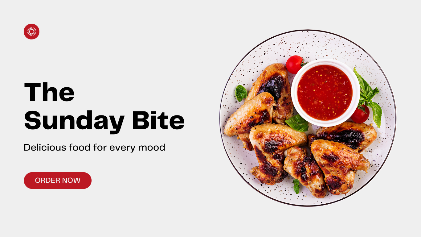 A plate of food with chicken wings and tomato sauce on a white plate.