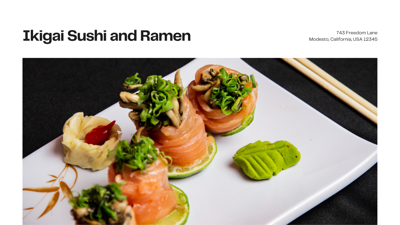 A white plate topped with sushi and ramen with chopsticks on a table.