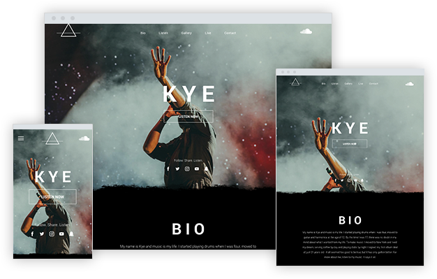 A man is standing on a stage with his hands in the air.