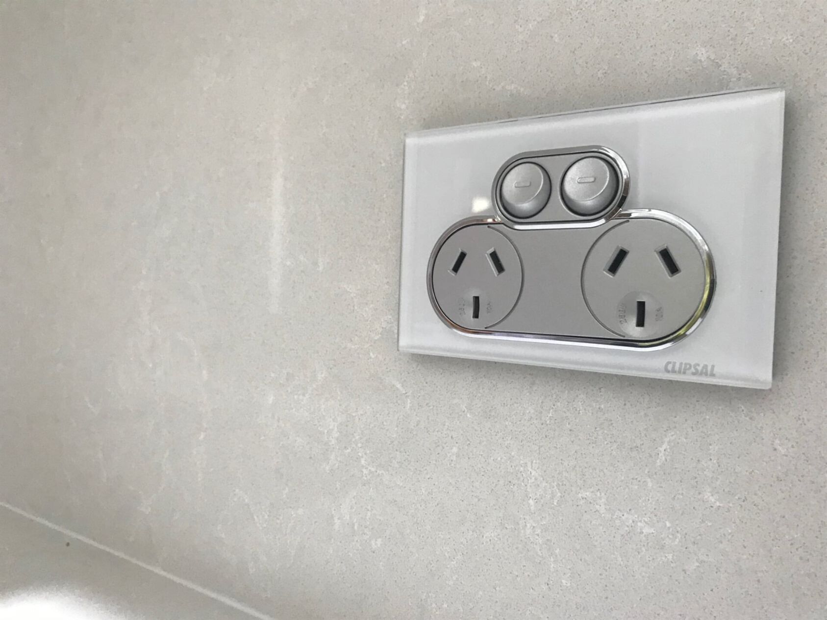A Close up Of a White Electrical Outlet on A Wall — A & J Electrical Contractors in Taminda, NSW