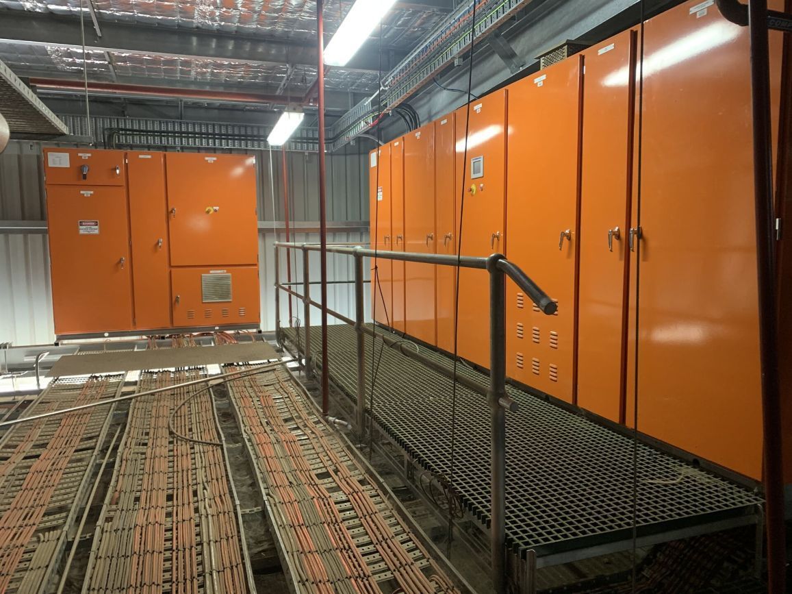 A Room with Orange Cabinets and A Ramp Leading to Them — A & J Electrical Contractors in Taminda, NSW