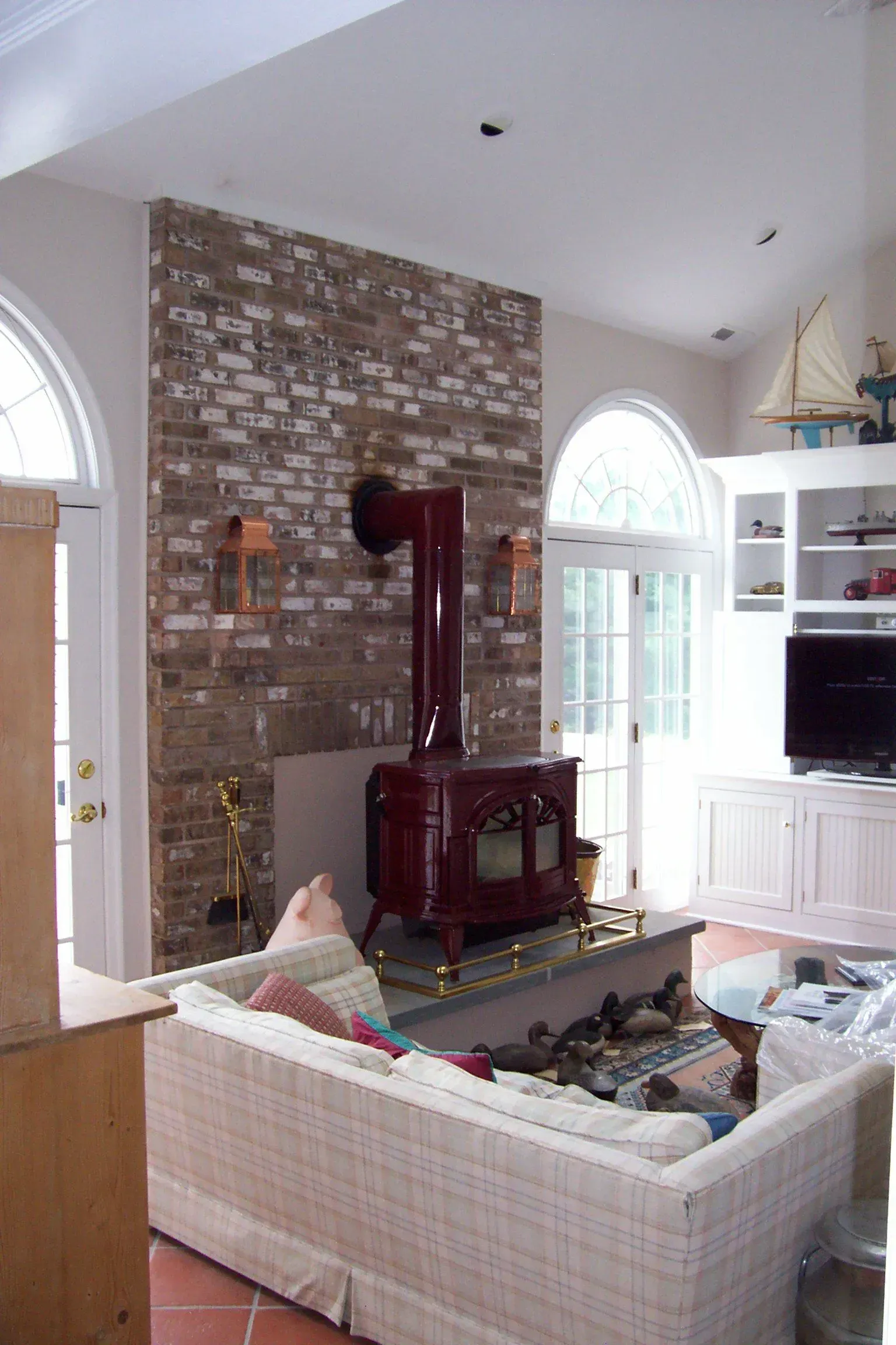 A living room with a fireplace and a couch