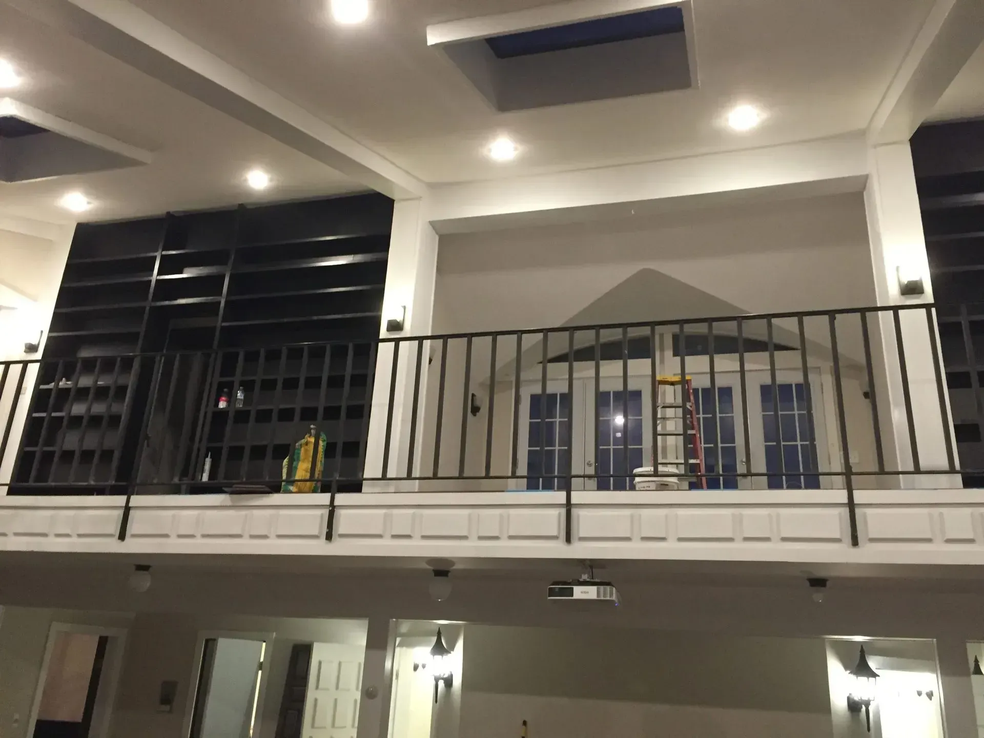 A balcony with a railing in a large room