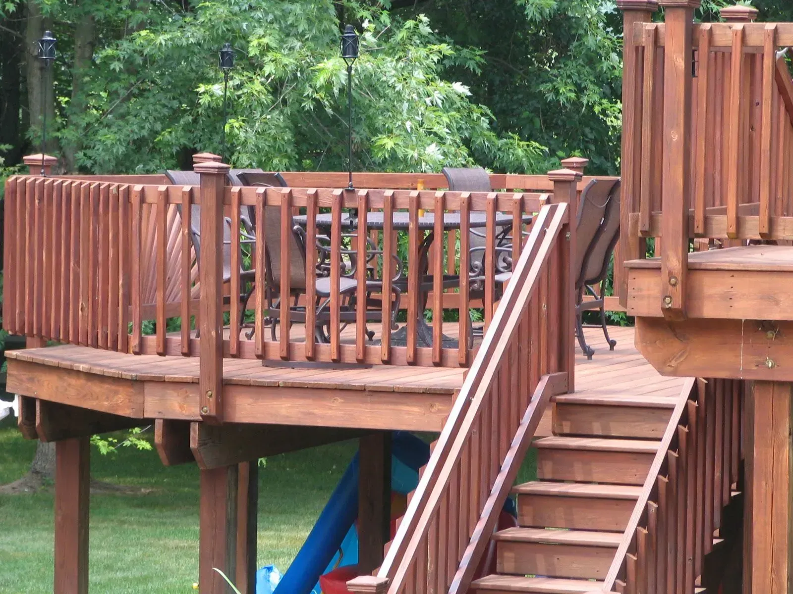 A wooden deck with stairs leading up to it