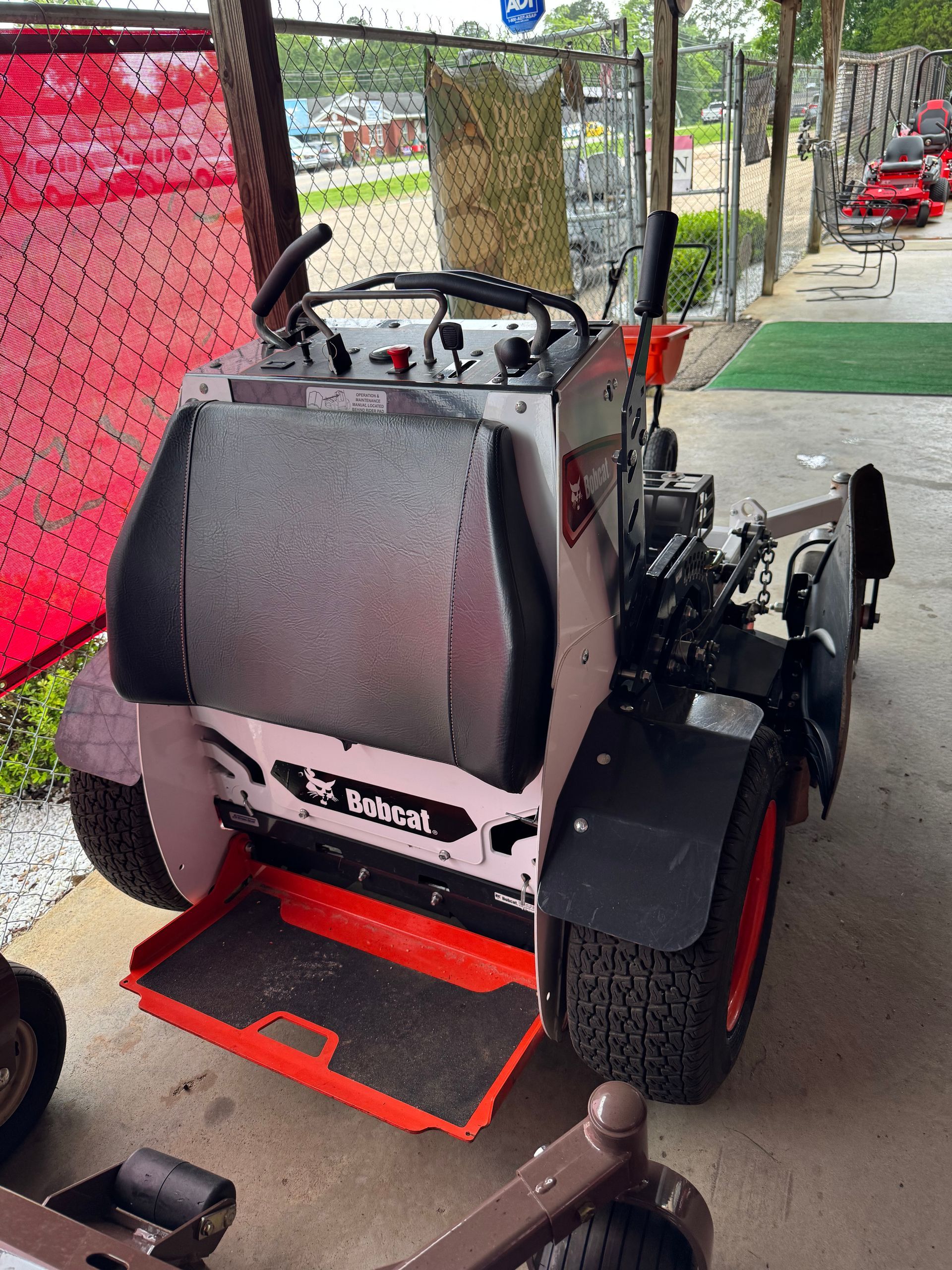USED BOBCAT STAND ON MOWER
