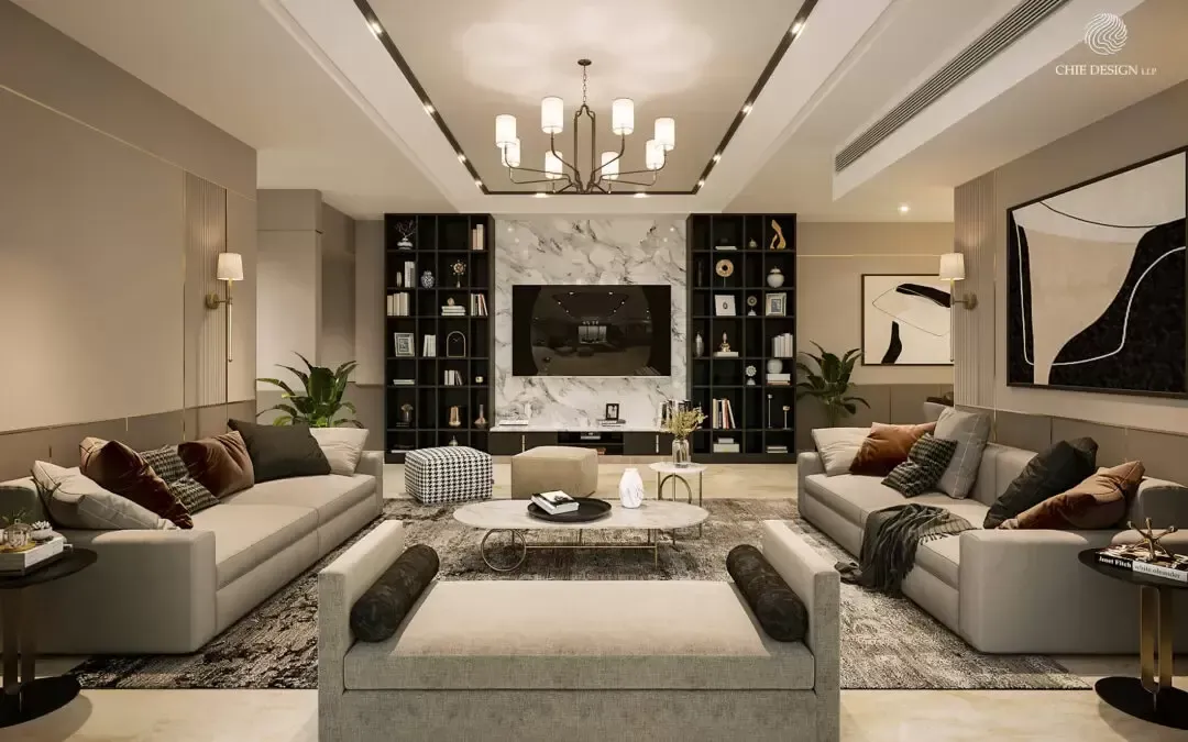 Luxurious living room with beige sofas, marble wall, bookshelves, and chandelier.