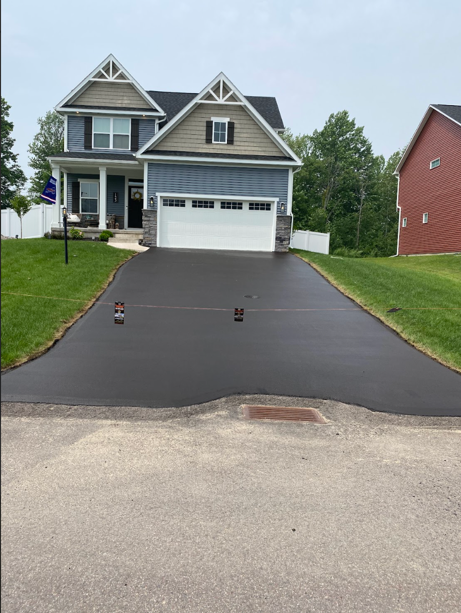 A large house with a driveway leading to it
