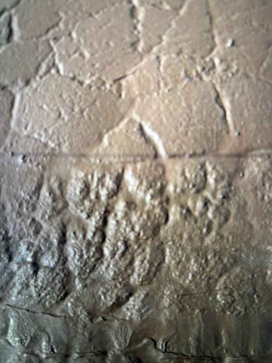 A close up of a concrete wall with a texture