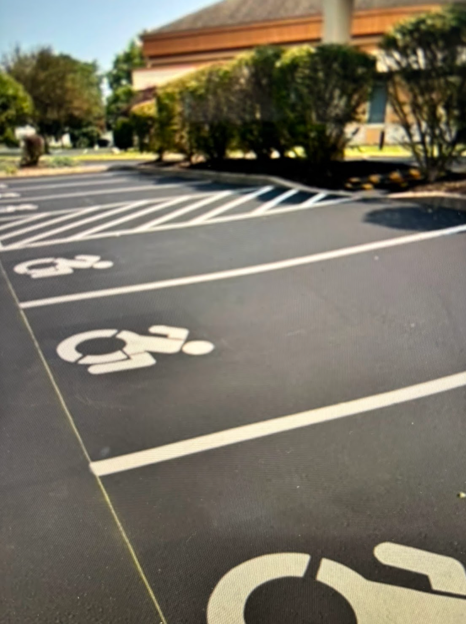 A parking lot with handicap signs painted on it