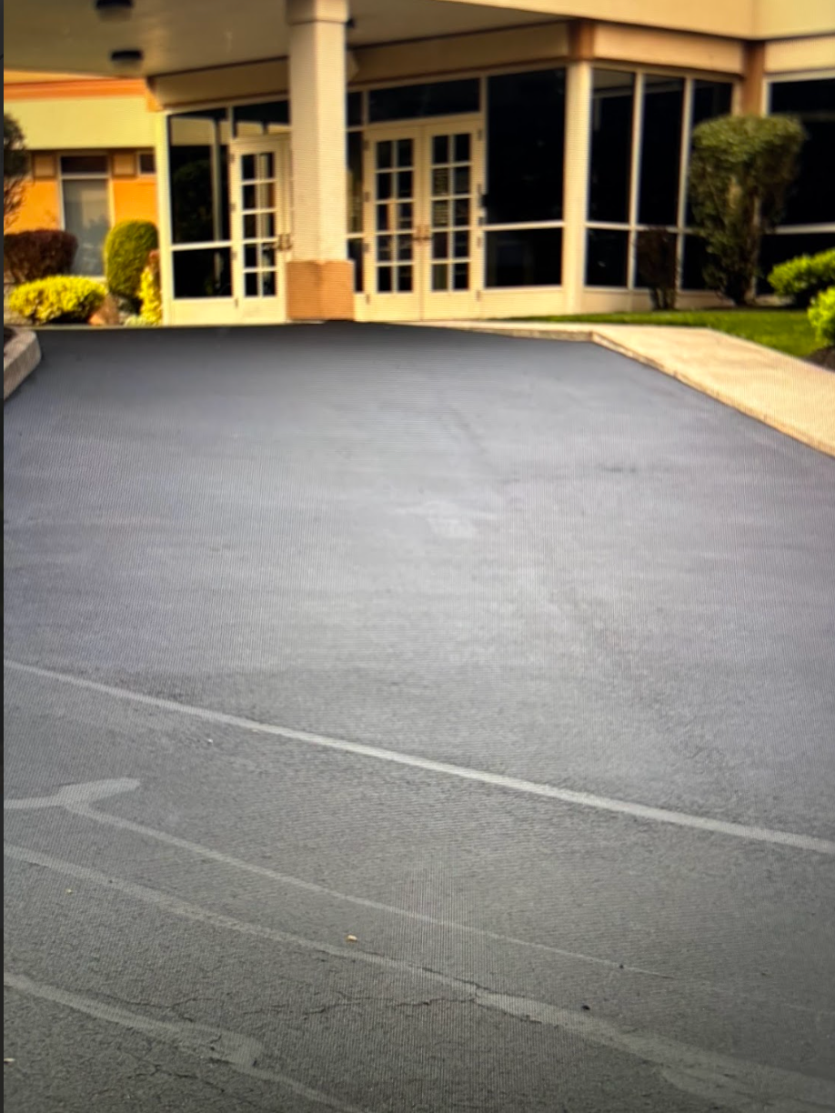 An empty parking lot in front of a building