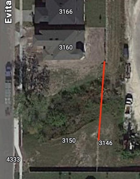 an aerial view of a house and a lot .