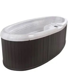 Oval-shaped hot tub with a dark brown exterior and a white interior.