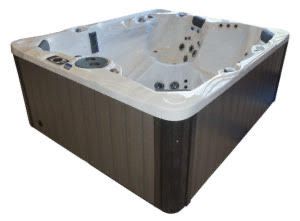 Square hot tub, gray siding, white rim, with multiple jets.