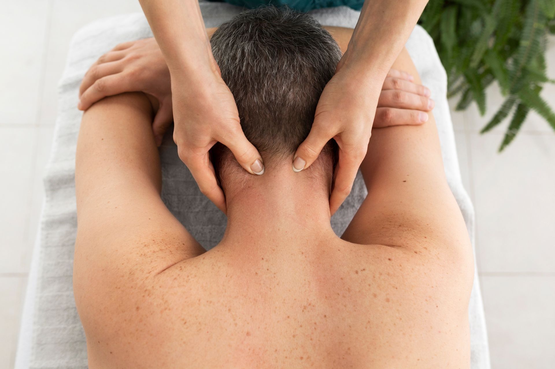 A man is getting a massage at a spa.
