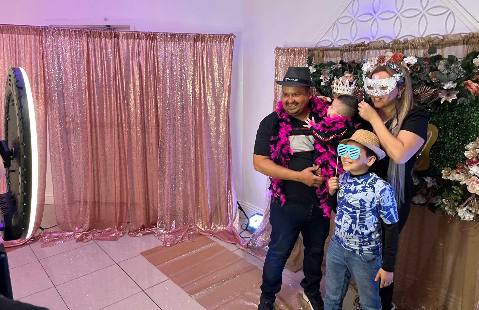 A family is posing for a picture in a photo booth.