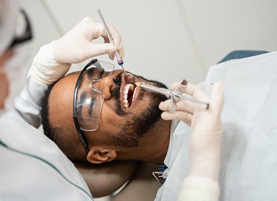 Cleaning Teeth Of Man — Strasburg, PA — Strasburg Dental Care