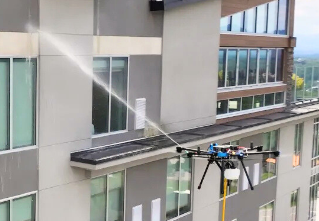 Drone washing commercial window and cleaning building in Perth Western Australia