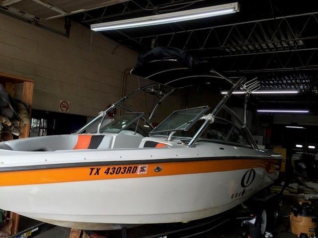 A boat with a license plate that says tx 430380