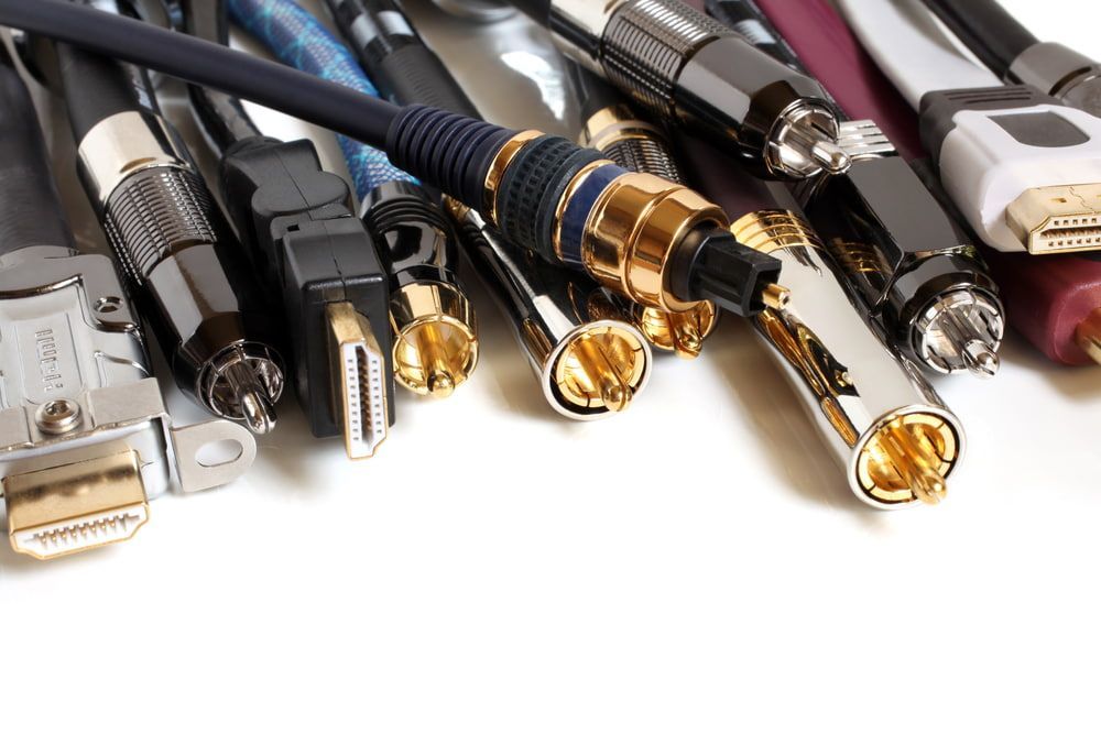 Various electronic cables with different connectors, including HDMI, DVI, and RCA, against a white background — Jendata In Douglas, QLD