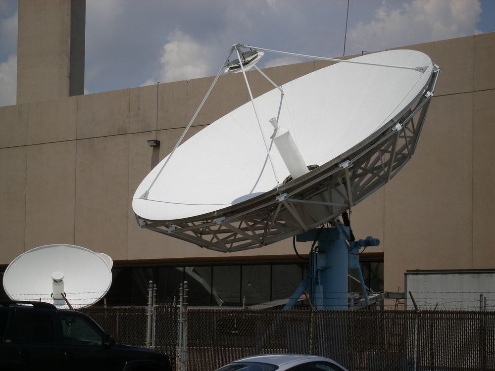 Large Satellite Dish on a Blue Stand, Angled Towards the Sky — Jendata In Annandale, QLD