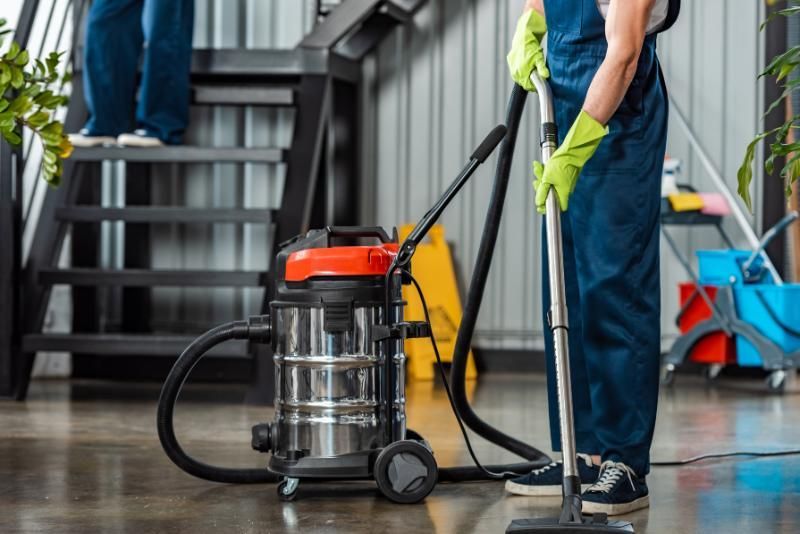 Containment barriers and HEPA-filtered vacuum system