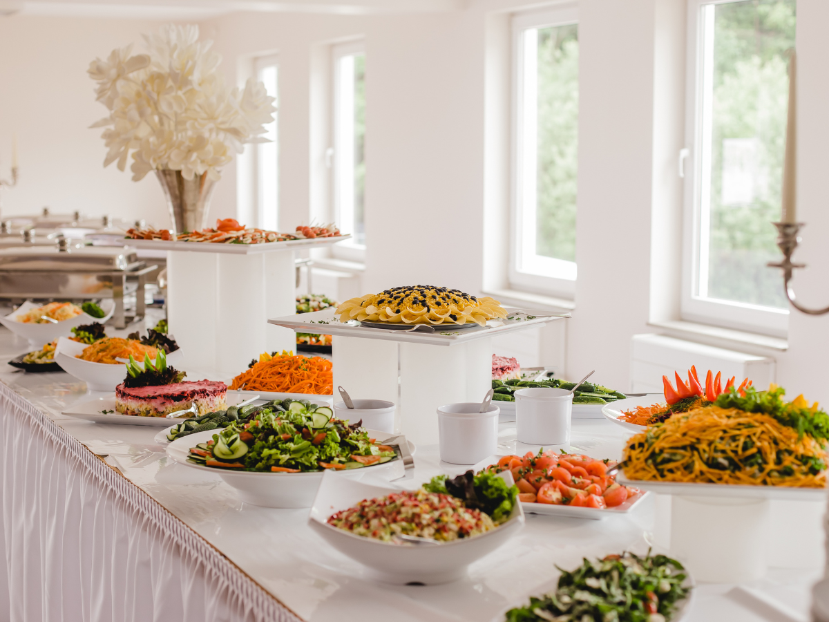 a buffet table with many different types of food for a wedding reception