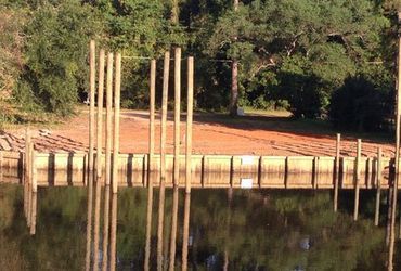 A dock is being built in the middle of a lake.