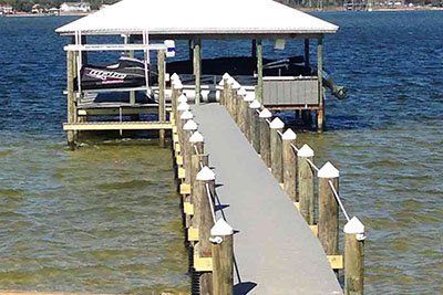 A dock with a boat on it in the water.