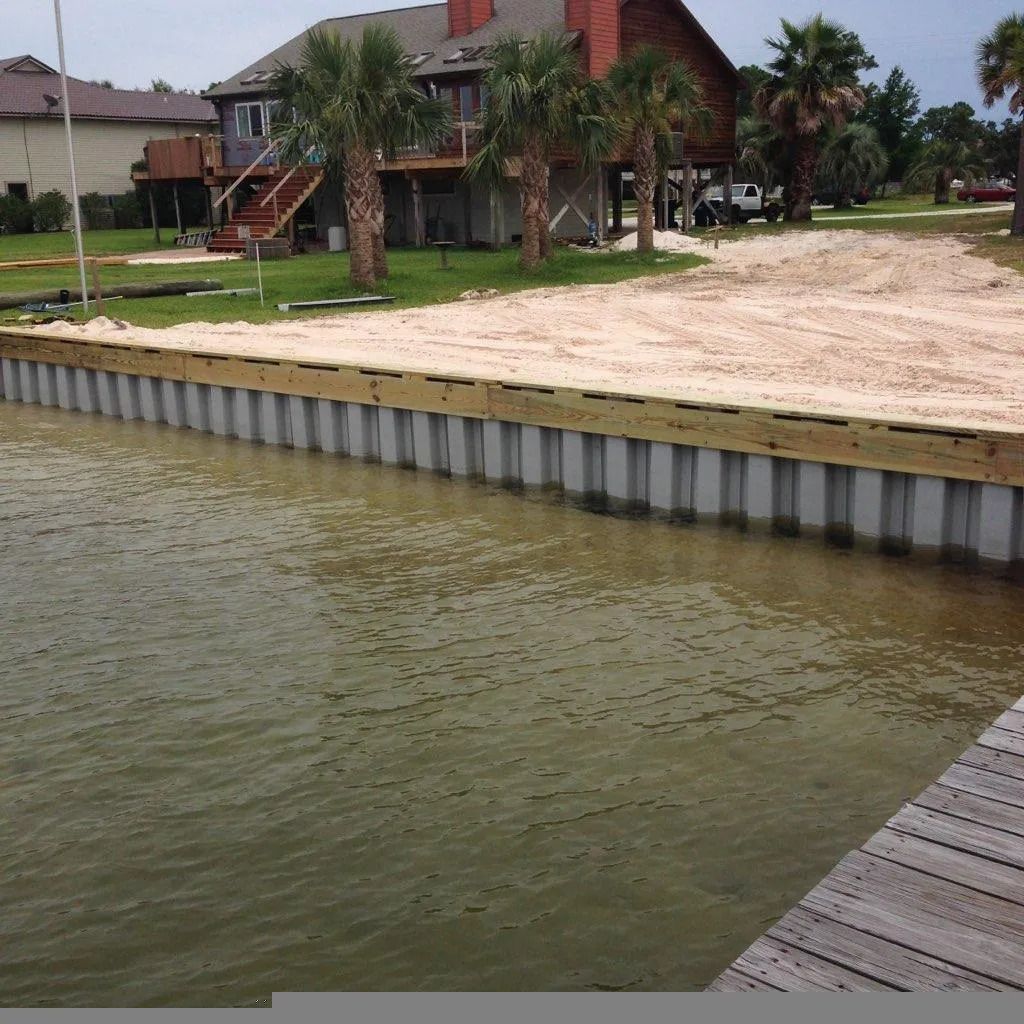A large body of water with a house in the background