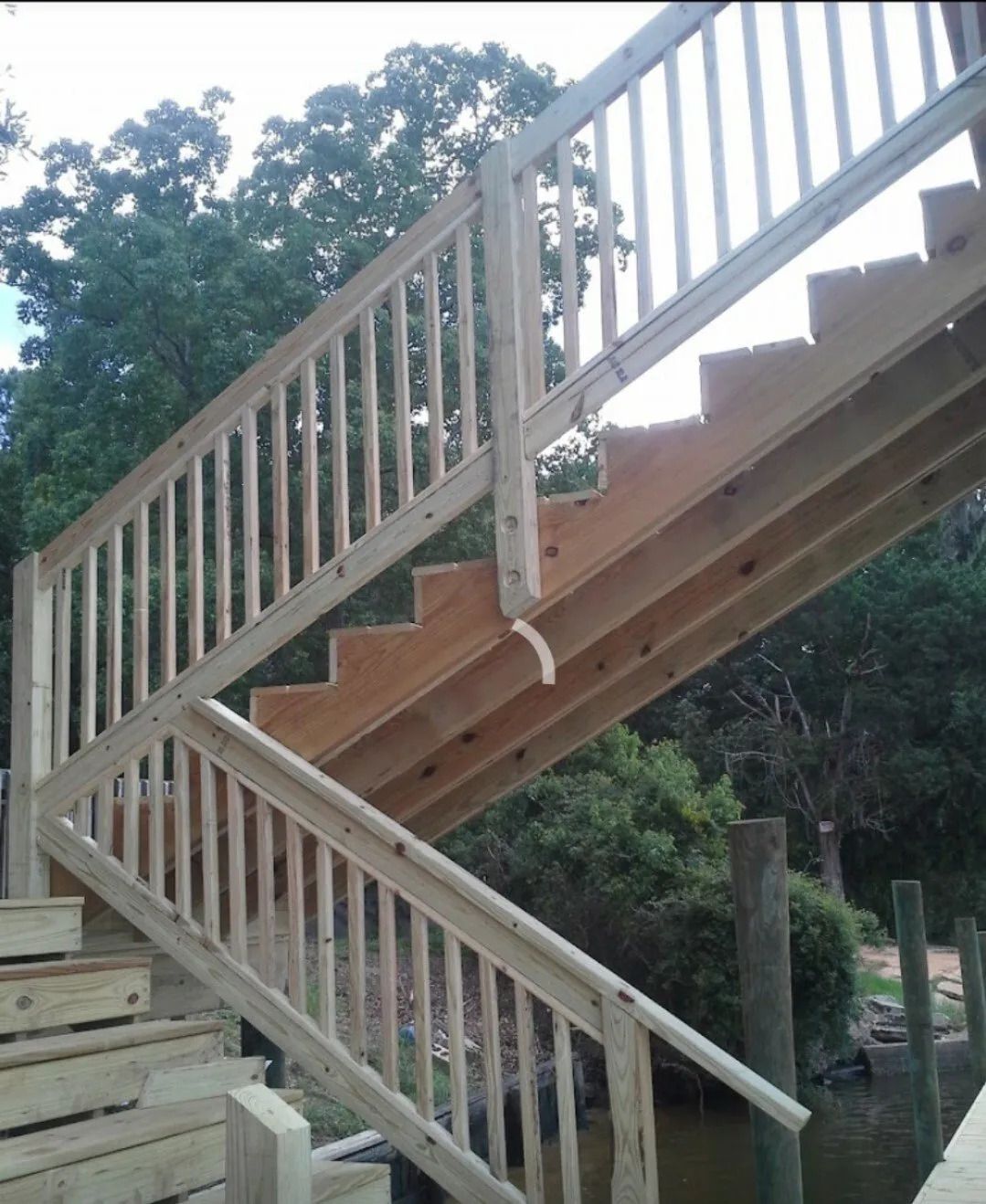 A set of wooden stairs leading up to a dock