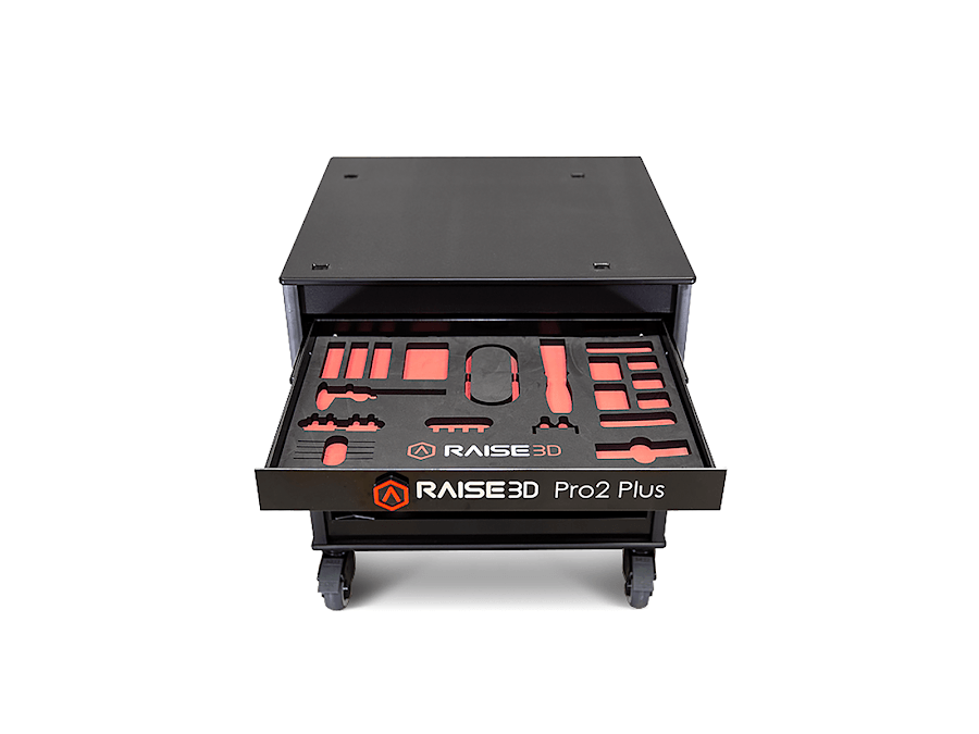 Een zwarte doos met een lade vol gereedschap op een witte achtergrond.