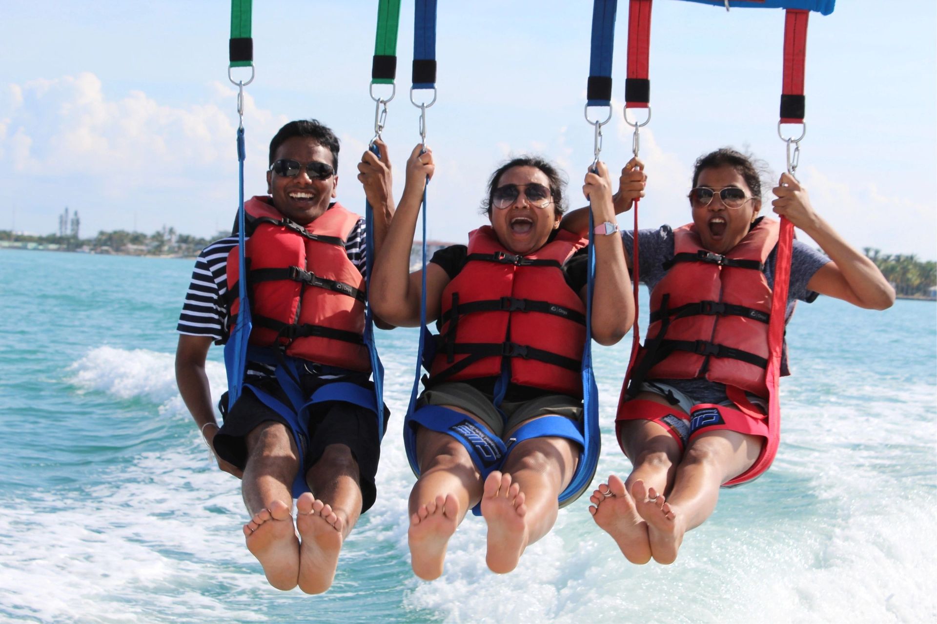 A group of people are parasailing in the ocean