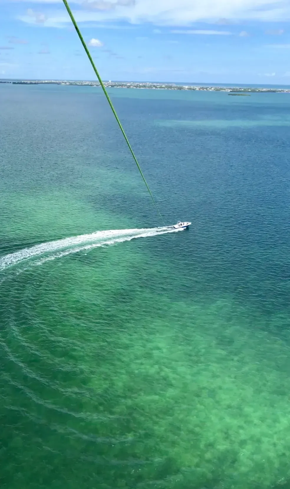 A boat is floating on top of a body of water.