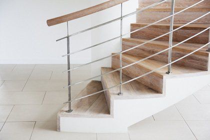 wooden staircase installed with steel balustrade