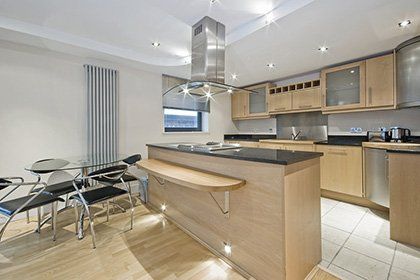 open kitchen area with island bar and dining