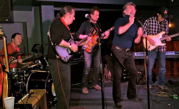 Billy Kurz sitting in and singing on  stage .