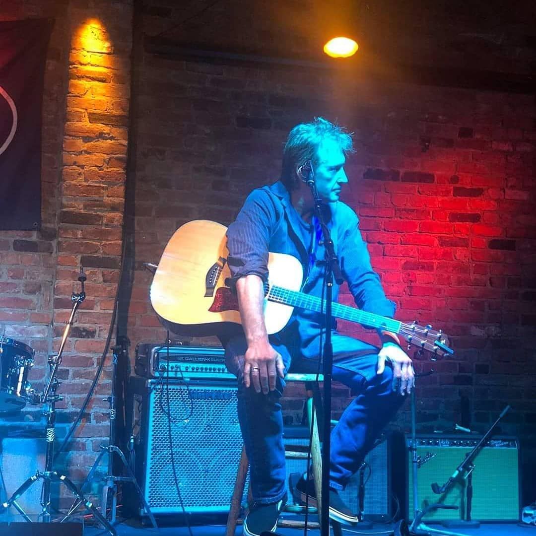 Matt  Feinberg sitting a stool