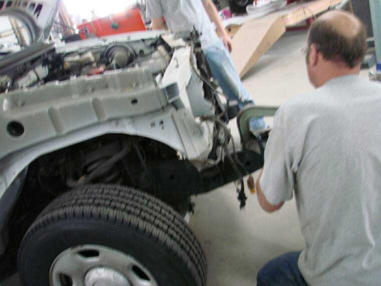 A person doing auto body repair near Athens, GA