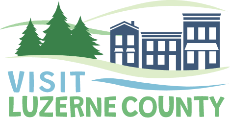 Visit Luzerne County logo with trees, buildings, and water in shades of blue and green.