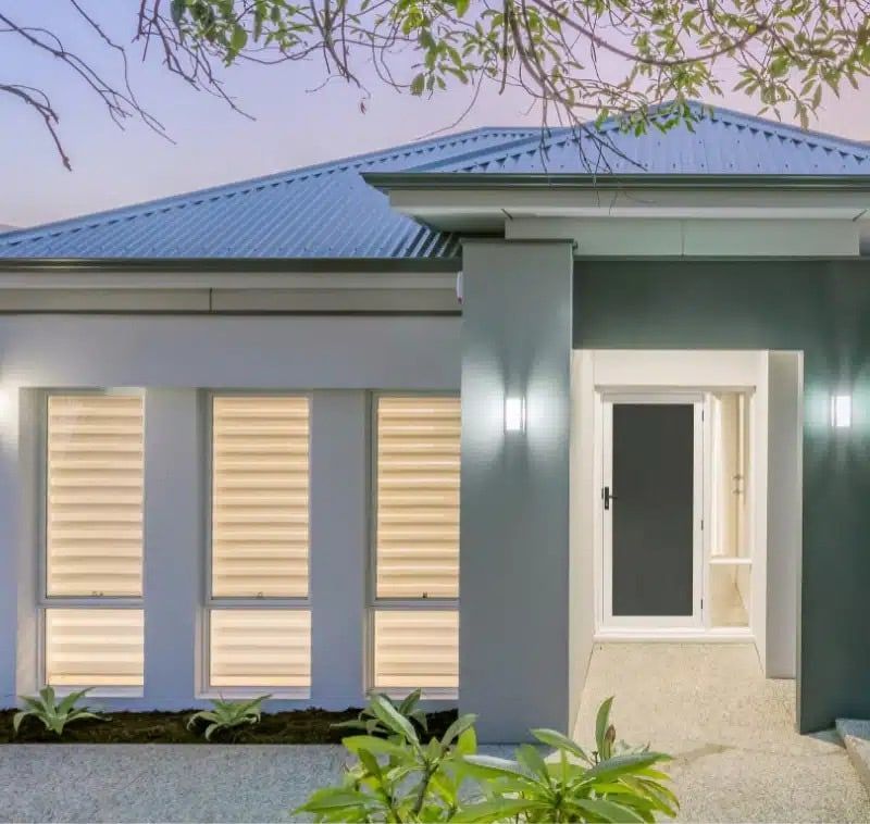 A House With A Blue Roof And A Black Door — North Ballina Windows In Tweed Heads, NSW