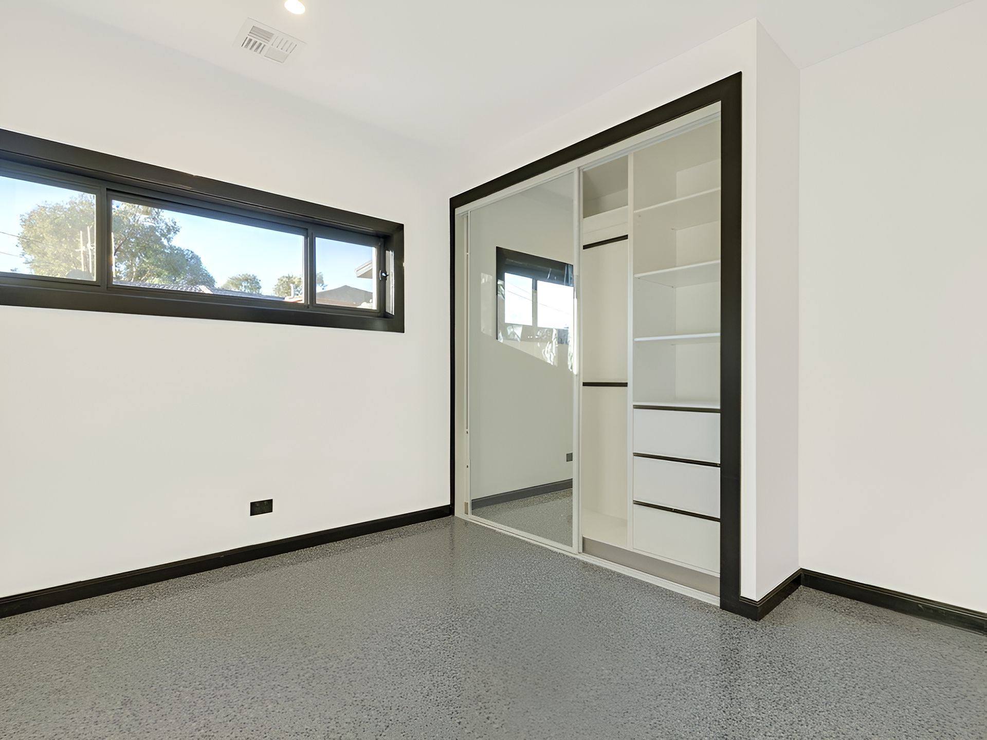 An inbuilt wardrobe with a sliding glass mirror door — North Ballina Windows In Ballina, NSW