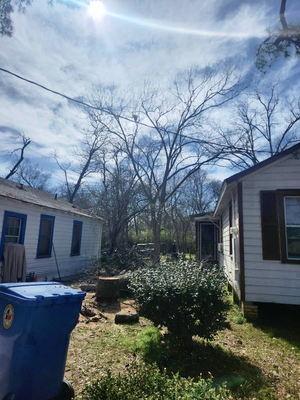 A house with a roof that has been damaged by a tornado.