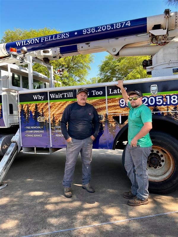 A house in the middle of a field with trees in the background.