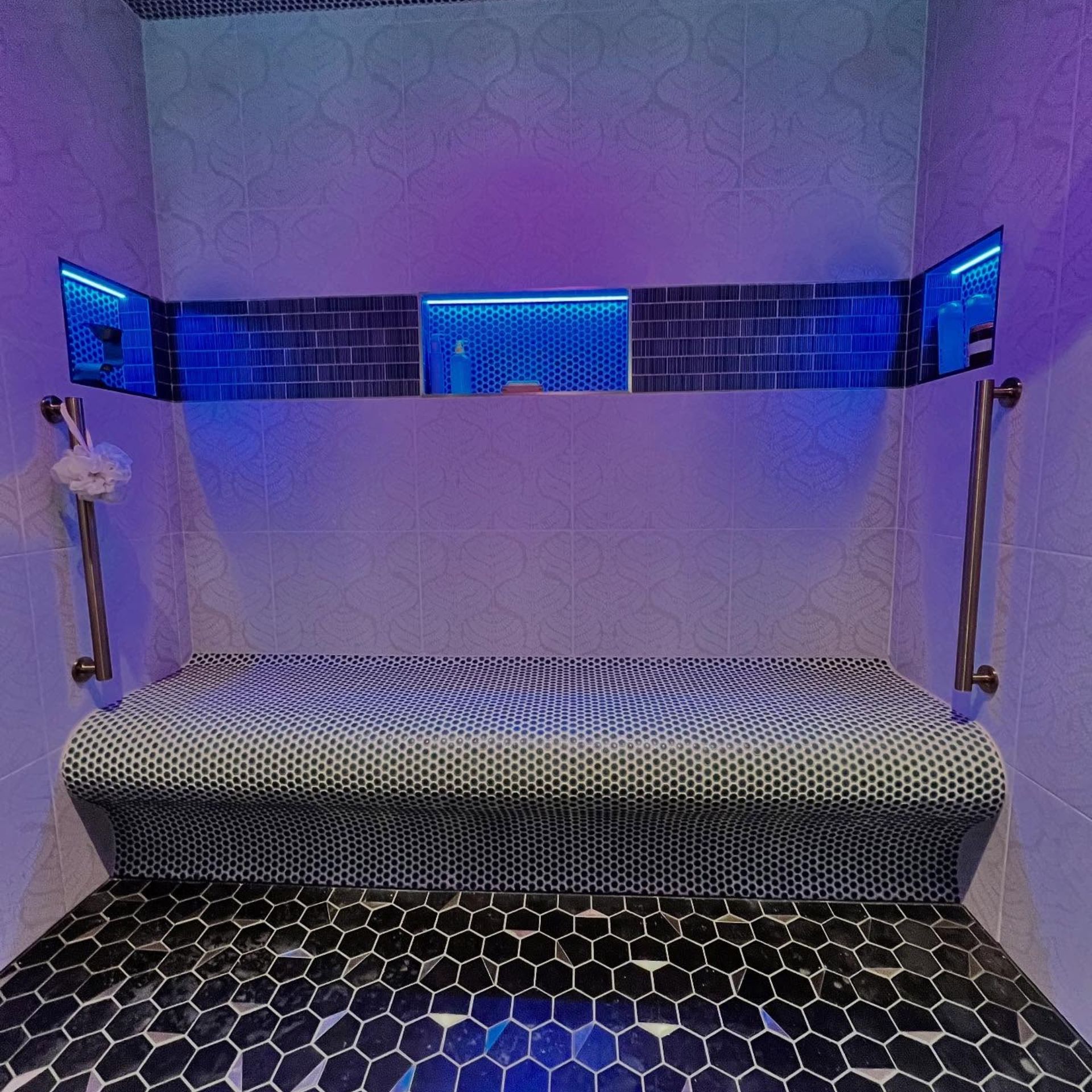 WCL Construction/Paint & Carpentry Inc - A bathroom with a bench and purple lights on the wall